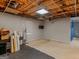 Spacious unfinished basement with natural light from a window and unfinished ceiling at 140 Joshua St, Palmetto, GA 30268