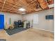 Spacious unfinished basement with blue door and natural light from a window at 140 Joshua St, Palmetto, GA 30268