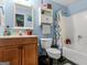 Cozy bathroom featuring blue walls, a sink with vanity, a toilet, and a shower with a curtain at 140 Joshua St, Palmetto, GA 30268