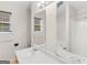 This bathroom features a vanity and a large mirror showing the bath and toilet at 140 Joshua St, Palmetto, GA 30268