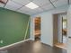 A simple bedroom featuring green walls, a closet and an open doorway at 140 Joshua St, Palmetto, GA 30268