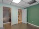 A simple bedroom featuring green walls, a closet and an open doorway at 140 Joshua St, Palmetto, GA 30268