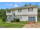 Charming two-story home with a well-maintained lawn and a blue front door, complete with green trim at 140 Joshua St, Palmetto, GA 30268