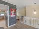 Open hallway features a view of the kitchen, living room, and staircase at 140 Joshua St, Palmetto, GA 30268