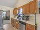 A cozy kitchen equipped with sleek countertops, stainless steel appliances, and wooden cabinetry at 140 Joshua St, Palmetto, GA 30268