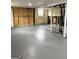 Unfinished basement with concrete floor and walls, offering potential for customization and additional living space at 599 Cherry Ln, Jonesboro, GA 30238
