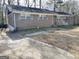 Brick home featuring a side entrance and a well maintained yard at 599 Cherry Ln, Jonesboro, GA 30238