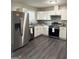Bright kitchen featuring stainless steel appliances and white cabinets at 599 Cherry Ln, Jonesboro, GA 30238