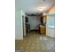 Kitchen area with oak cabinets, window, and linoleum floors at 60 Doe Run Dr, Sharpsburg, GA 30277