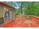 View of an outdoor red-painted deck, ideal for enjoying nature at 497 Fire Fly Dr, Tucker, GA 30084