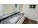 Well-lit bathroom featuring a granite countertop, stylish vanity, and modern fixtures at 530 Austin Dr, Mcdonough, GA 30252
