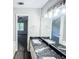 A primary bathroom with dual sinks, granite countertops, and large mirror at 530 Austin Dr, Mcdonough, GA 30252