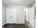 Bedroom with neutral walls, carpet flooring, closet and door leading to another room at 530 Austin Dr, Mcdonough, GA 30252
