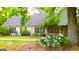 Beautiful home with lovely landscaping, flowers, green lawn and inviting front porch at 530 Austin Dr, Mcdonough, GA 30252