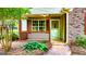Inviting front porch with wood railing and brick accents, complemented by mature greenery at 530 Austin Dr, Mcdonough, GA 30252