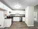 A modern kitchen featuring white cabinets, stainless steel appliances, and granite countertops at 530 Austin Dr, Mcdonough, GA 30252
