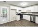 A modern kitchen featuring white cabinets, stainless steel appliances, and granite countertops at 530 Austin Dr, Mcdonough, GA 30252