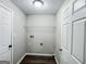 Functional laundry room including utility hookups, ample storage, and convenient shelving at 530 Austin Dr, Mcdonough, GA 30252