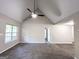 Large, airy living room featuring a fireplace and ceiling fan, perfect for relaxation and entertainment at 530 Austin Dr, Mcdonough, GA 30252