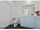 Well-lit bathroom with a white vanity, mirror, and a shower with a curtain at 109 Feeney Lane, Villa Rica, GA 30180