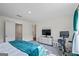Well-appointed bedroom featuring a bed, TV, exercise bike, and ensuite bath at 109 Feeney Lane, Villa Rica, GA 30180
