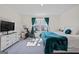 Spacious bedroom with a comfortable bed, TV, exercise bike and plenty of natural light at 109 Feeney Lane, Villa Rica, GA 30180