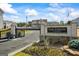 Community entrance featuring a stone sign, gated entry, and lush landscaping with flowering plants at 109 Feeney Lane, Villa Rica, GA 30180