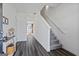 Inviting foyer with hardwood floors, staircase and white walls leading to living area at 109 Feeney Lane, Villa Rica, GA 30180