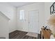 Welcoming foyer featuring dark wood floors and white walls with door to living area at 109 Feeney Lane, Villa Rica, GA 30180