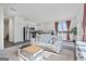 Open-concept layout combining the living room and kitchen for easy entertaining at 109 Feeney Lane, Villa Rica, GA 30180