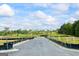This street view of the property includes an empty asphalt road with a hill in the background at 109 Feeney Lane, Villa Rica, GA 30180