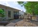 Outdoor back deck with seating, grill, and access to a well-maintained backyard at 254 Roberts Trl, Locust Grove, GA 30248