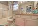 Bathroom with white vanity, tub-shower combo, and decorative nautical accents at 254 Roberts Trl, Locust Grove, GA 30248