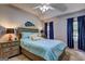 Comfortable bedroom with a vaulted ceiling, soft lighting, and a decorative fish accent at 254 Roberts Trl, Locust Grove, GA 30248