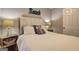 Bright bedroom with a beach theme, white shuttered headboard and decorative lamps at 254 Roberts Trl, Locust Grove, GA 30248