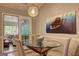 Bright dining area featuring a glass table and an adjacent living space at 254 Roberts Trl, Locust Grove, GA 30248