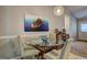 Cozy dining area with a glass table, comfortable chairs, and stylish decorations at 254 Roberts Trl, Locust Grove, GA 30248