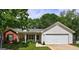Inviting single Gathering home with well-manicured lawn, attached garage, and traditional design elements at 254 Roberts Trl, Locust Grove, GA 30248