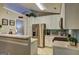 Bright kitchen with stainless steel appliances, white cabinets, and ample counter space at 254 Roberts Trl, Locust Grove, GA 30248