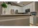 Contemporary kitchen with white cabinetry, stainless steel appliances, and decorative backsplash at 254 Roberts Trl, Locust Grove, GA 30248