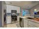 Modern kitchen featuring stainless steel appliances, white cabinets, and stylish backsplash at 254 Roberts Trl, Locust Grove, GA 30248