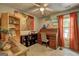Cozy office space with a roll-top desk, shelving, and plenty of natural light at 254 Roberts Trl, Locust Grove, GA 30248