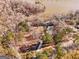 Aerial view of the property highlighting the extensive wooded lot and proximity to the lake at 405 Miller Rd, Covington, GA 30014