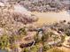 High angle aerial showcases a lake and the many houses in the surrounding area at 405 Miller Rd, Covington, GA 30014