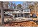 Backyard features a lovely stone patio, a fire pit, a hammock and several Adirondack chairs at 405 Miller Rd, Covington, GA 30014