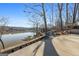 Lake view backyard with a seating area, docks, and firepit at 405 Miller Rd, Covington, GA 30014