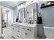 Stylish bathroom with double vanity, modern mirrors, and neutral color scheme at 405 Miller Rd, Covington, GA 30014