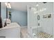 Modern bathroom with glass shower, double sinks, and stylish fixtures at 405 Miller Rd, Covington, GA 30014