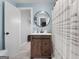 Bathroom features a sliding door vanity and shower with decorative curtain, creating a modern design at 405 Miller Rd, Covington, GA 30014
