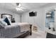 Bedroom featuring neutral color scheme, a large bed, and an ensuite bathroom offering relaxation and comfort at 405 Miller Rd, Covington, GA 30014
